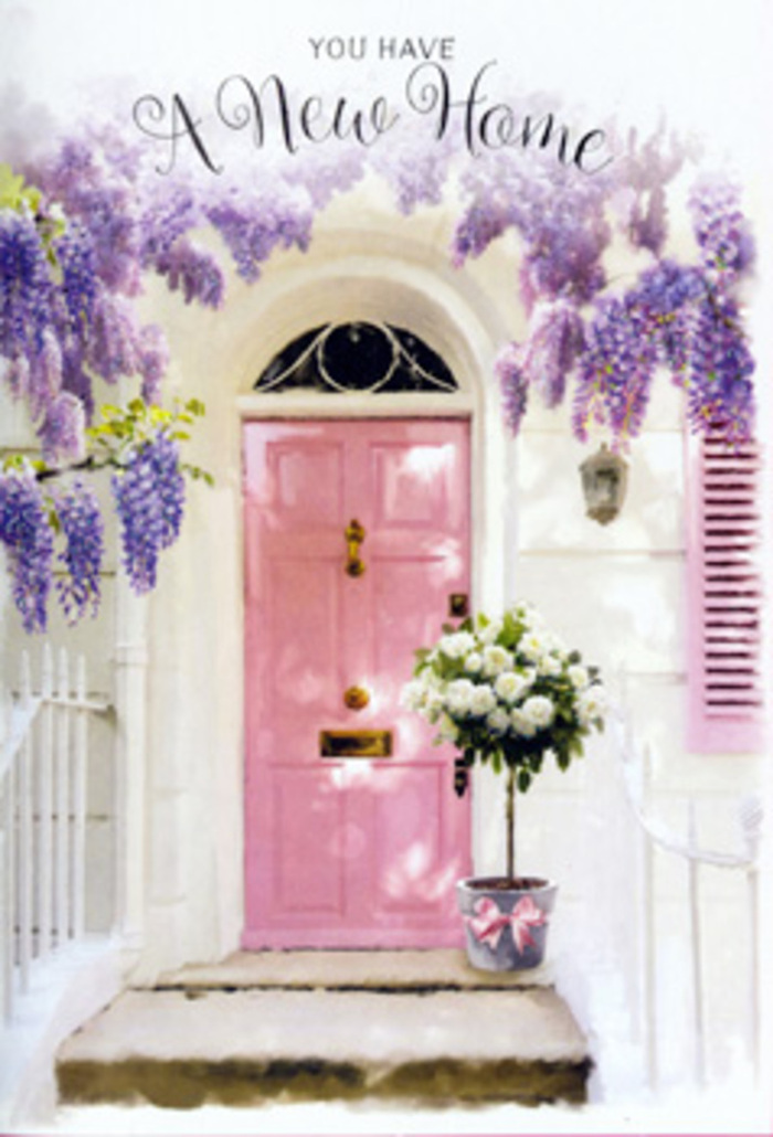 A softly painted pink door becomes the welcoming focal point of this tranquil entrance scene, reminiscent of a quiet corner off the main Castelnau thoroughfare. The door's pastel surface, subtly brushed and slightly matte, stands out against crisp white walls, with a delicate shutter painted in a matching rose-washed hue to the side. Cascading above the frame, generous tendrils of wisteria burst into full bloom, their clusters of lavender and mauve flowers hanging low like scented curtains. Each blossom forms part of an abundant canopy, suggesting the gentle, powdery perfume you might notice on a spring walk between Castelnau and the leafy streets of Barnes. At the doorstep, a stylish grey metal bucket sits firmly on the stone, holding a hand-crafted arrangement of white and cream roses. The roses are lush and full-headed, their layered petals slightly ruffled, accompanied by fresh, soft green foliage that spills naturally over the rim. A satin ribbon in tender pink wraps around the base of the bucket, tied in a graceful bow that mirrors the door's tone and completes the pastel harmony. Sunlight glows across the entry, illuminating each petal and casting gentle shadows along the step, so the whole composition feels serene yet quietly celebratory. The image suggests a housewarming gift, perhaps delivered by a local Castelnau florist for someone moving into a new home near the river or towards Hammersmith Bridge. Everything about the scene-colour, fragrance, and form-speaks of welcome, reassurance, and the joyful anticipation of memories yet to be made on the other side of that door.